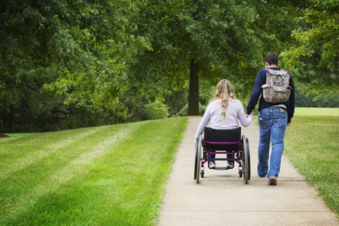 Couple holding hands in park