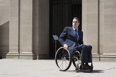 Paraplegic businessman sitting in wheelchair