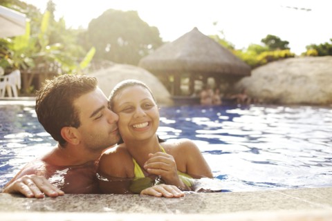 Couple hugging in swimming pool