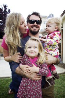 Caucasian family standing in backyard