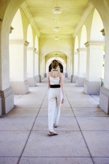 Caucasian woman walking in portico