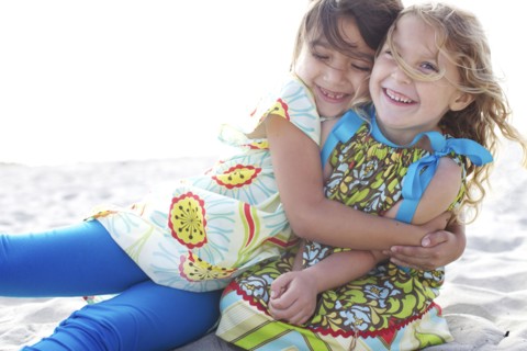 Children hugging on beach