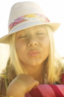 Mixed race girl making kissing motion