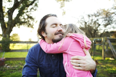 Father hugging daughter