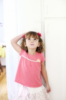 Mixed race girl measuring her height