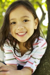Mixed race girl smiling outdoors