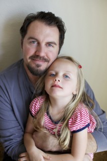Father and daughter smiling