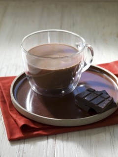 Hot chocolate and chocolate bar on plate