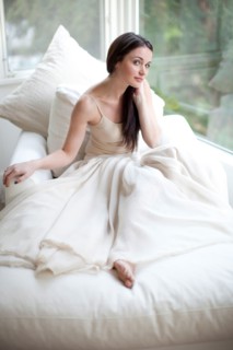 Glamorous Caucasian woman sitting on sofa