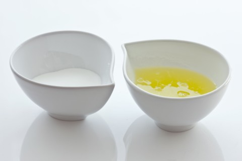 Bowls with sugar and egg whites