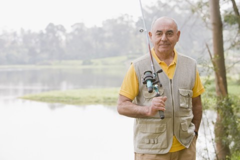 Senior Hispanic man fishing