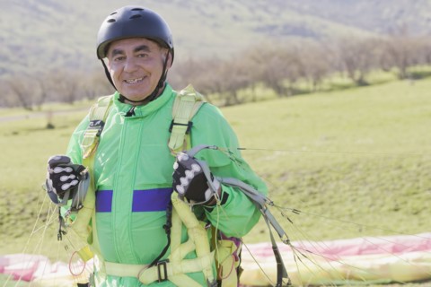 Senior Hispanic man skydiving