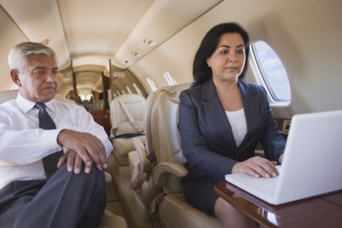Business people working on private jet