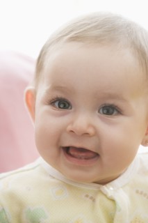 Smiling Hispanic baby girl