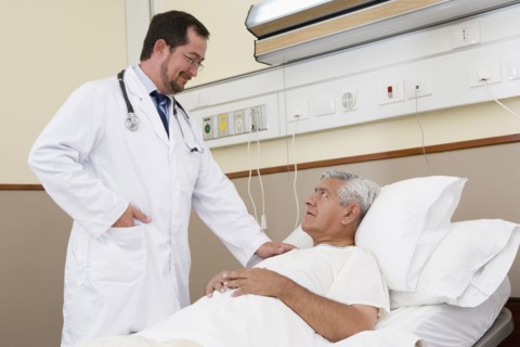 Doctor talking with patient in hospital