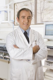 Hispanic technician standing in office