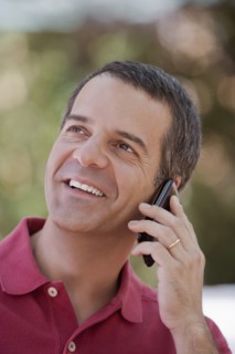 Hispanic man talking on cell phone