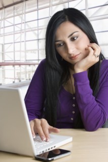 Turkish businesswoman typing on laptop