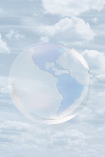 Transparent globe floating in sky