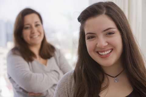 Smiling Chilean mother and daughter