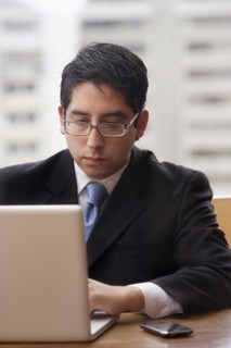Chilean businessman using laptop