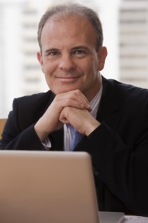 Chilean businessman sitting at desk