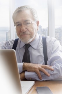 Hispanic businessman working at desk