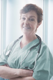 Hispanic doctor smiling in hospital
