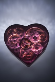 Mechanical gears turning in heart shape