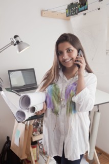 Hispanic architect talking on cell phone