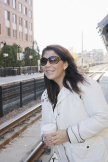 Hispanic woman waiting for train