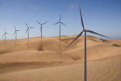 Row of wind turbines in desert