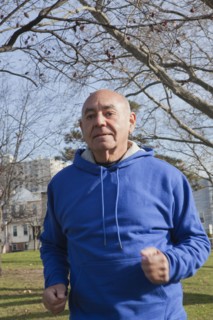 Hispanic man jogging in park