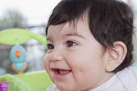 Smiling Hispanic baby boy