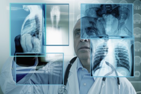 Hispanic doctor using virtual computer screen