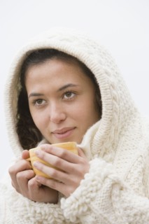 Hispanic woman drinking coffee