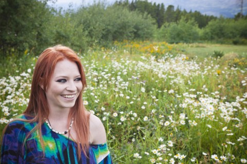 Caucasian woman standing in field