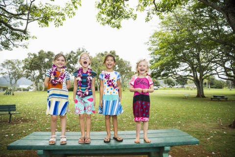 Girls standing together on picnic table