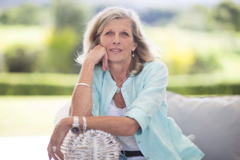 Caucasian woman sitting on sofa outdoors