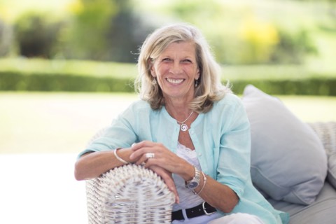 Caucasian woman sitting on sofa outdoors