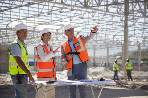 Architects talking at construction site