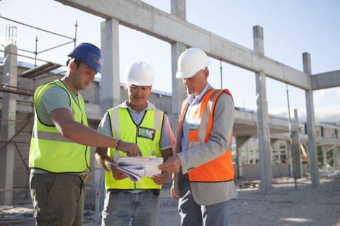 Architects talking at construction site