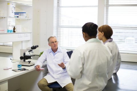 Scientists talking in laboratory