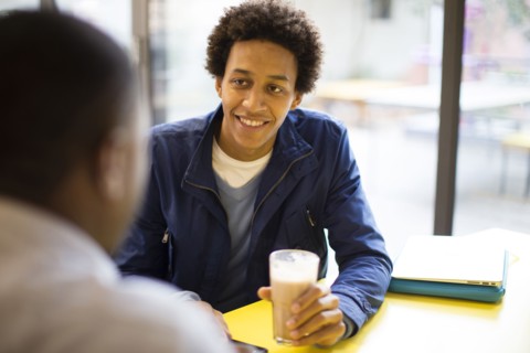 Men drinking coffee in cafe