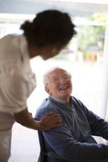 Doctor talking to patient in wheelchair