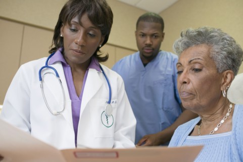 African female doctor with co-workers