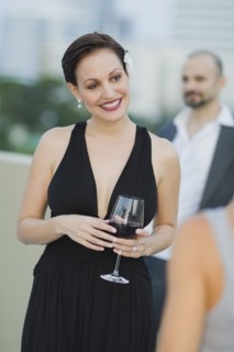 Cuban woman holding wine glass