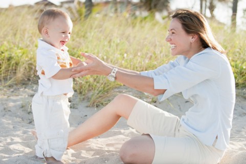 Mother and son enjoying the beach