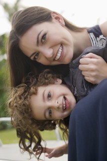 Smiling Hispanic woman with son