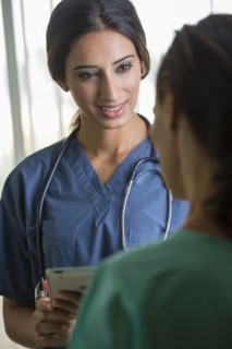 Nurses using tablet computer